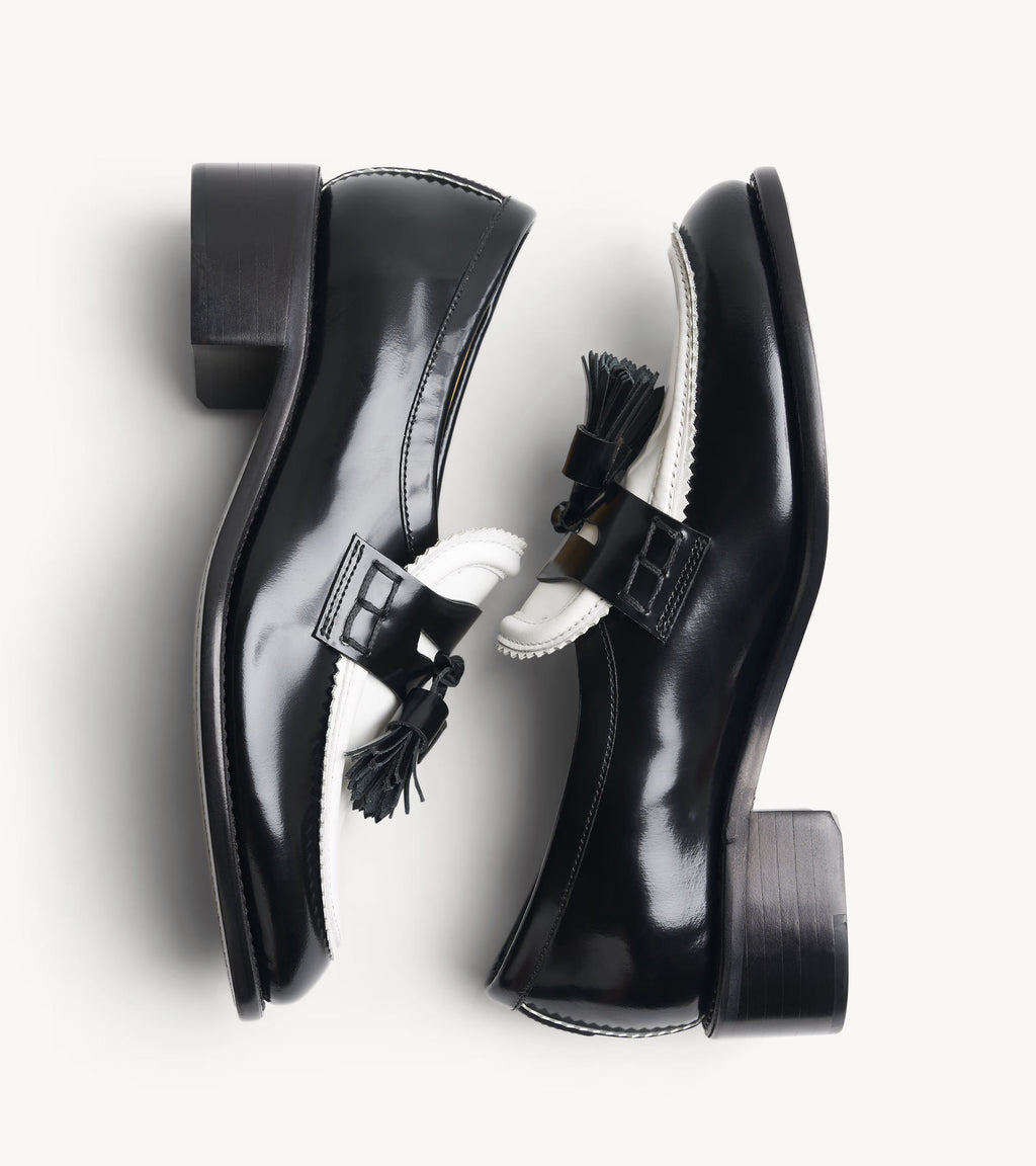 Miss Tenley Loafer — angled pair of black leather loafers