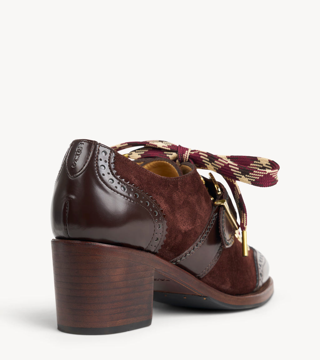Mrs. Logan Midheel — back three-quarter view of the brown suede heel