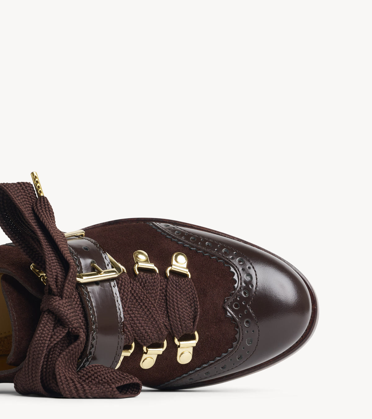 Mrs. Logan Midheel — close-up of the toe cap on the brown suede heel