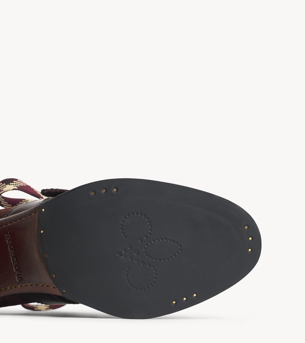 Mrs. Logan Midheel — angled pair of brown suede heels