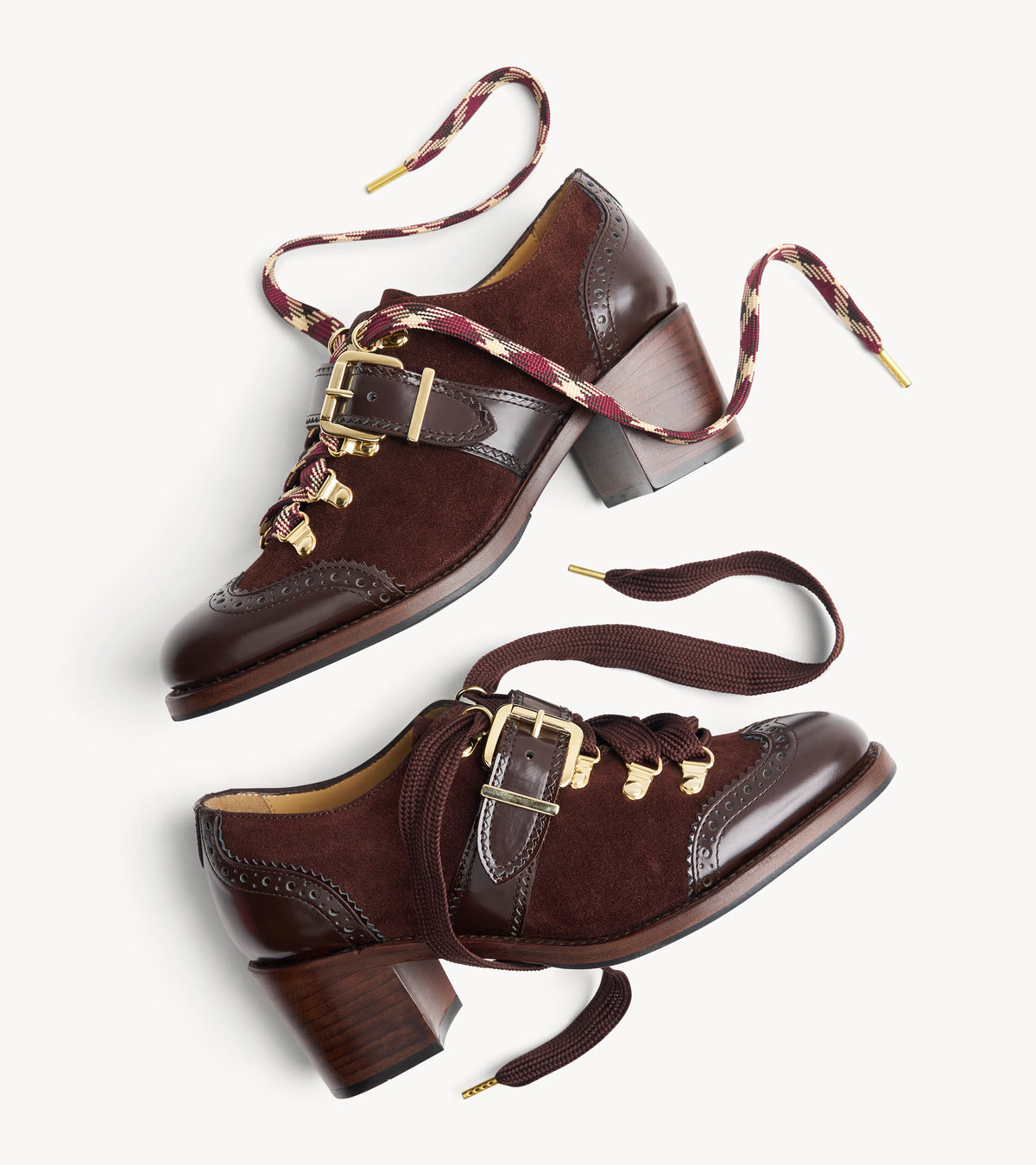 Mrs. Logan Midheel — rubber sole of the brown suede heel