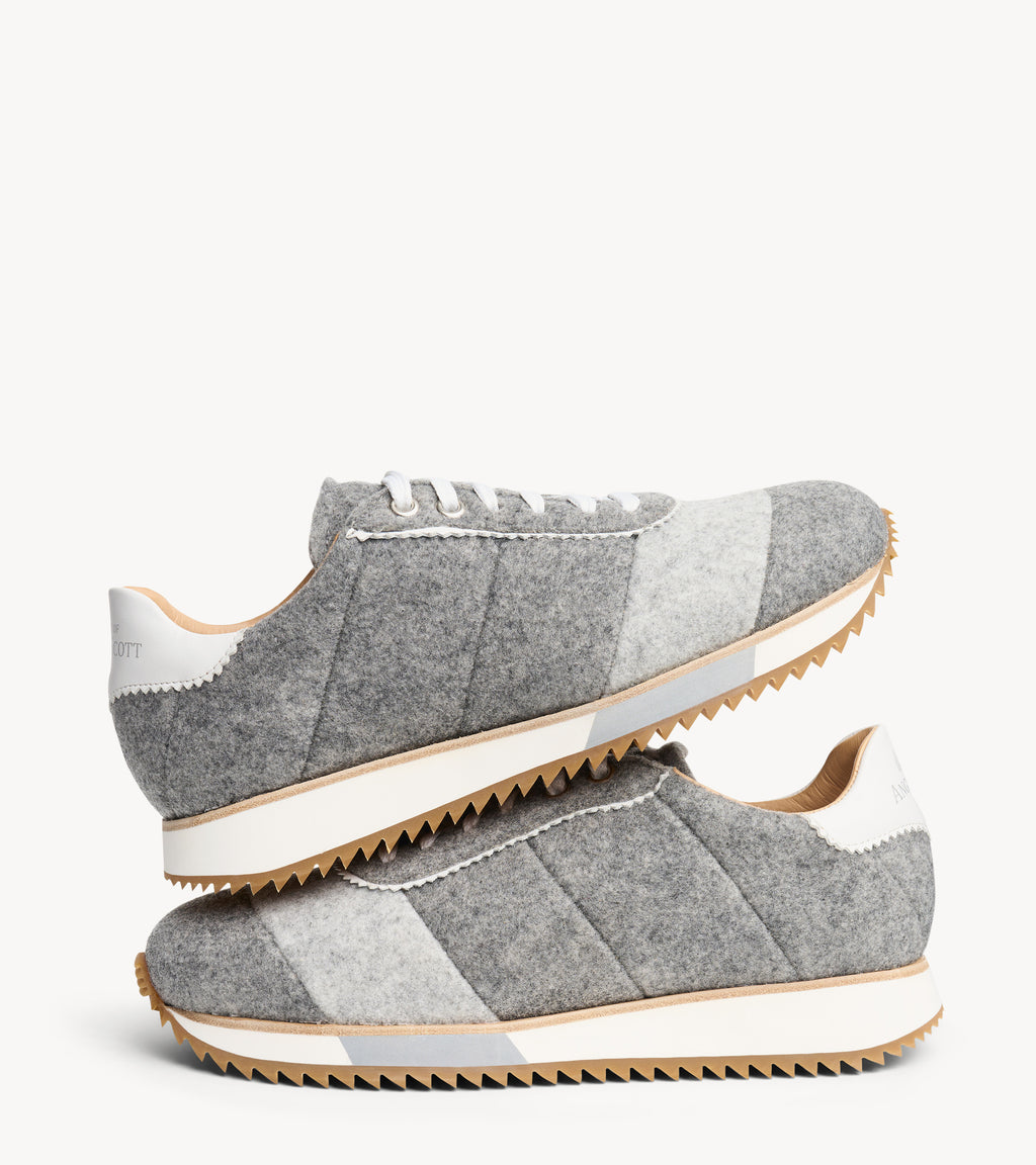 The Quinn Sneaker — angled pair of grey wool sneakers