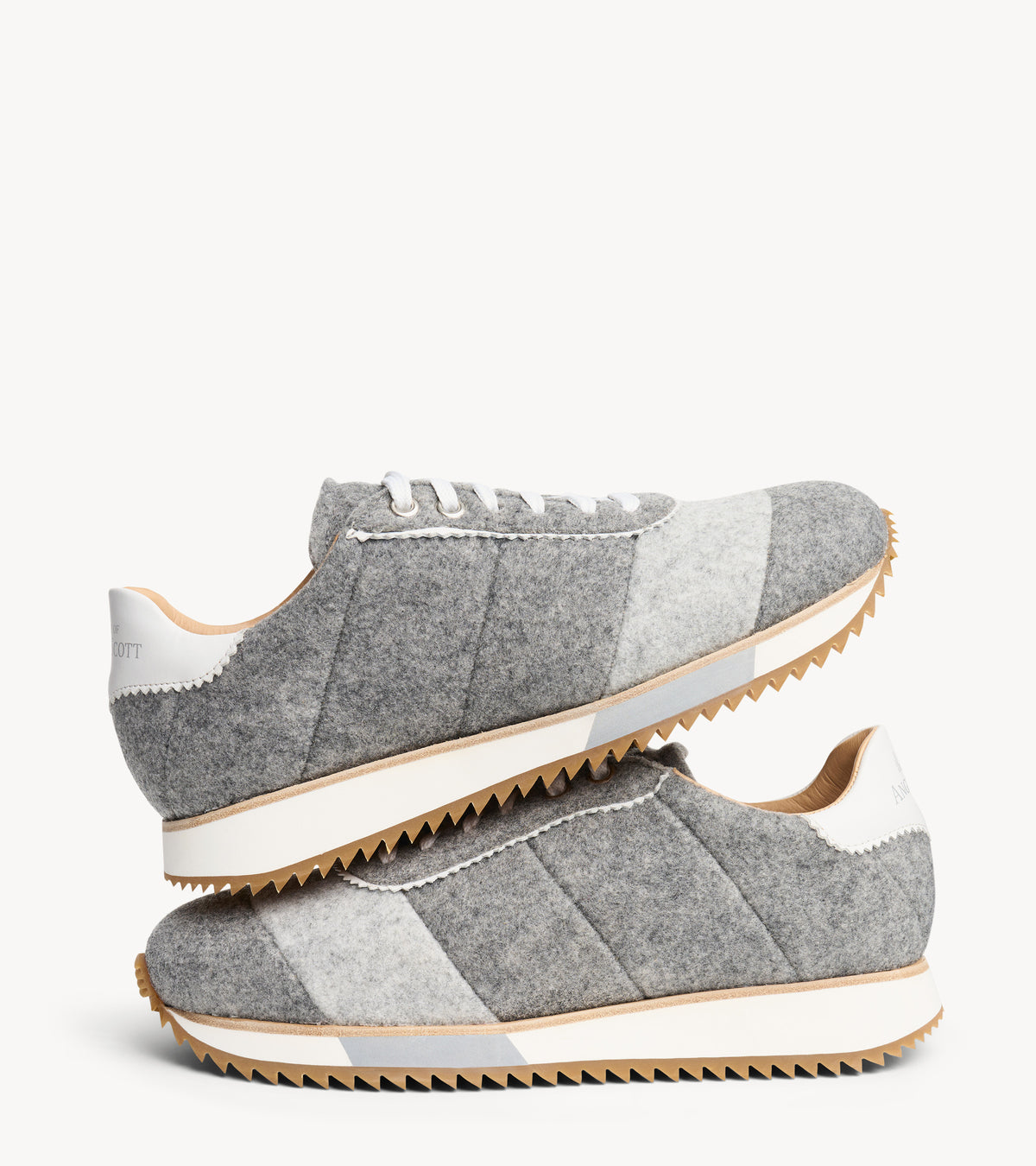 The Quinn Sneaker — angled pair of grey wool sneakers