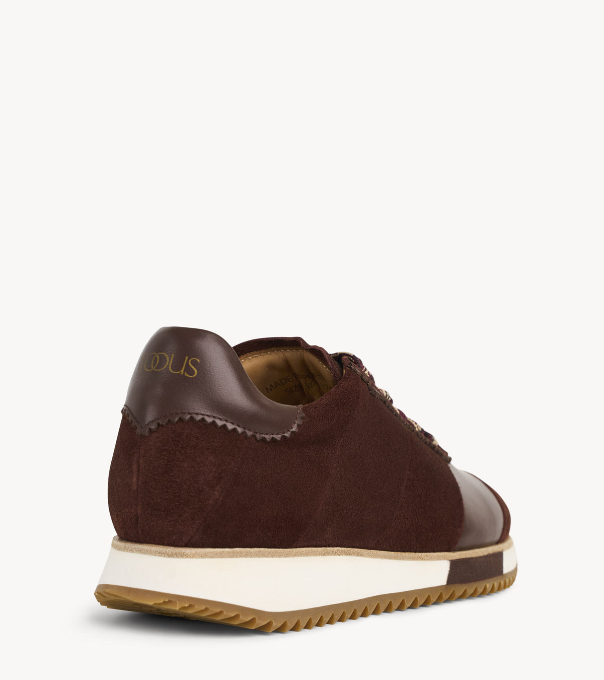The Quinn Sneaker — back three-quarter view of the brown suede sneakers