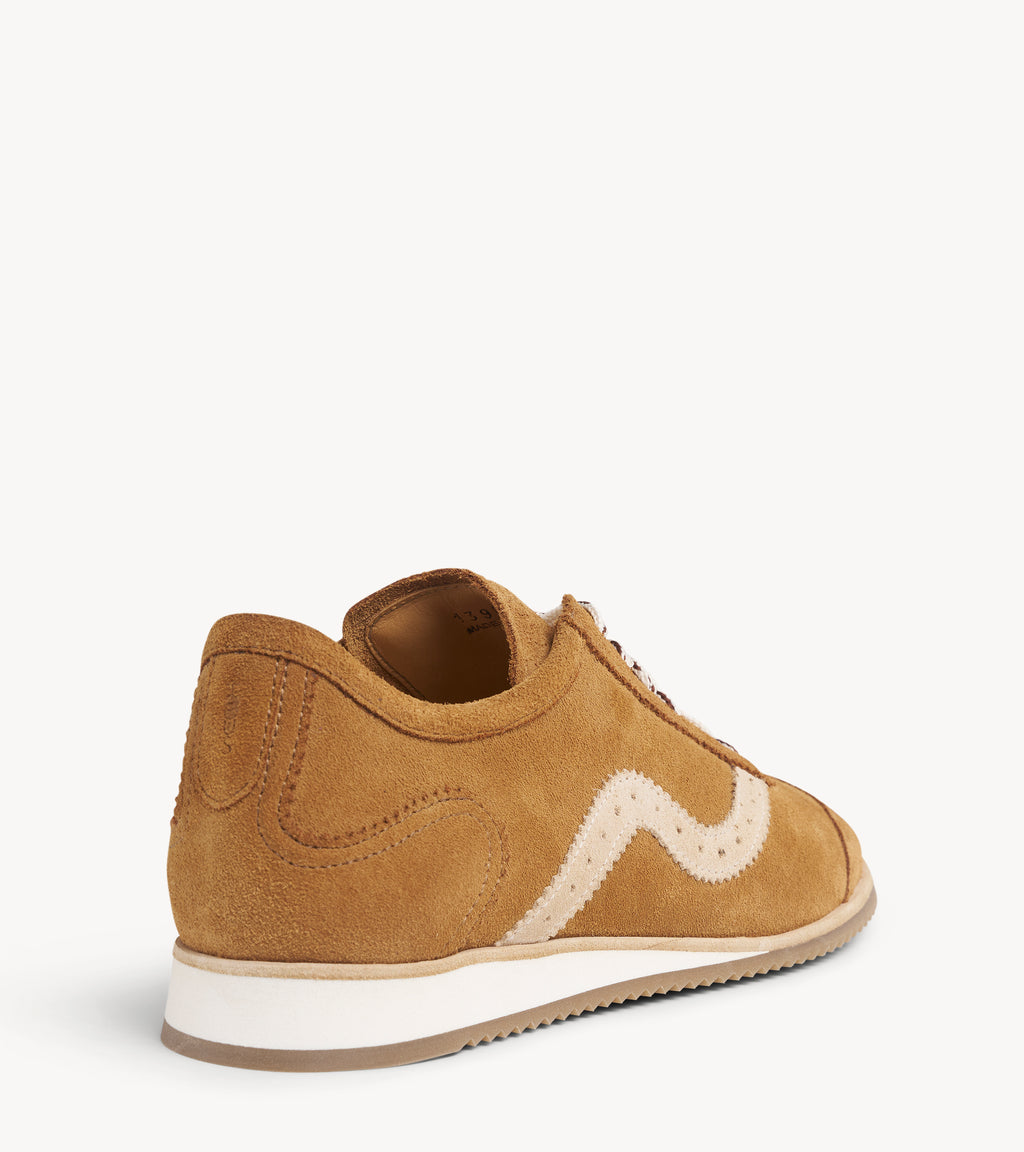 The Remi Slim Sneaker — close-up of the lacing and stitching on the multicolor suede sneakers