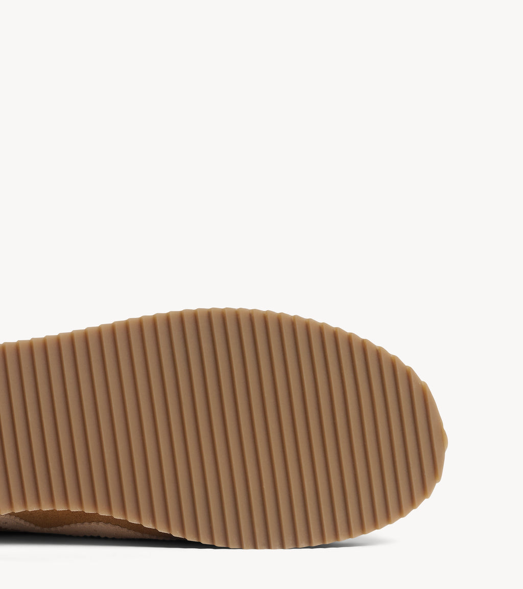 The Remi Slim Sneaker — rubber sole of the multicolor suede sneakers